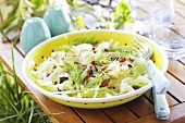 White cabbage salad with raisins, sunflower seeds and dill