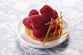 Raspberry tartlets with caramel latticework