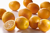 Several oranges and half an orange
