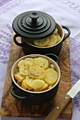 Two pots of potato bake