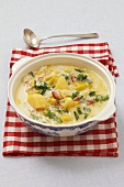 Leek and potato soup with sour cream and bacon