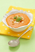 Cream of carrot soup with slivered almonds