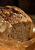 Wholemeal bread with oats on a piece of paper