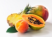 Summer fruits: pineapple, papaya, peach and mango