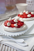 Meringue tarts with strawberries marinated in ginger syrup