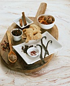 Assorted spices on wooden board