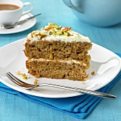 A piece of carrot cake with mascarpone filling