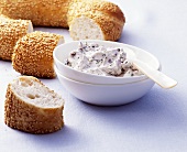 Soft cheese dip with olives to serve with sesame bread