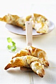 Puff pastry croissants filled with bacon and herbs