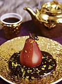 Red wine pear with chocolate sauce