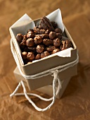 Chocolate-coated nuts