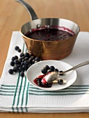 Blueberry and apple jam in pan and on plate