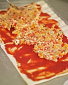 Spreading vegetable filling on dough (for pizza pinwheels)