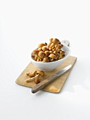 Nameko mushrooms in bowl on chopping board