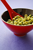 Wasabi peas in lacquer bowl with spoon