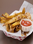 Chips in paper dish with ketchup