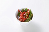 Mangetout and red pepper with spicy Asian sauce