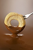 Apple ring in chocolate sauce