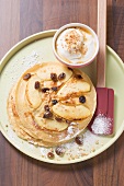 Apple pancakes with yoghurt and crushed praline