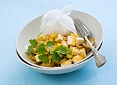 Tofu curry with rice and coriander leaves