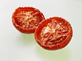 Two dried tomato halves