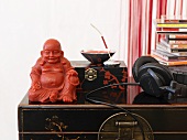 Buddhafigur, Musik-CDs und Kopfhörer