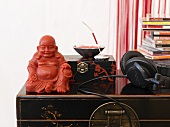 Buddha figure, music CDs and headphones