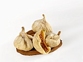 Several dried figs, one cut open