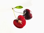 Pair of cherries (whole and half a cherry)