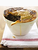 Beef pot pie, a spoonful removed