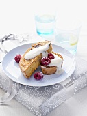 Slices of apple & raspberry loaf with cream & fresh raspberries