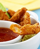 Crispy chicken sticks with chilli sauce