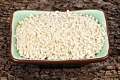White sesame seeds in rectangular dish
