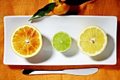 Halves of three different citrus fruits