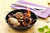 Flambéing duck breast with plums