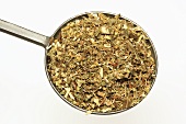Dried golden rod leaves on measuring spoon