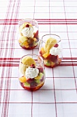 Three mini-trifles for children on checked tablecloth
