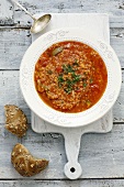 Tomato soup with lentils, couscous and chilli