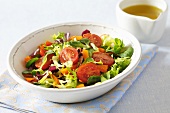Mixed salad leaves with cocktail tomatoes and carrots