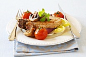 Pork chop with mushrooms, tomatoes and onions