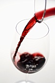 Pouring red wine into glass