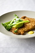 Breaded escalope with broccoli and lime wedge