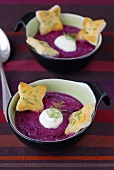 Red cabbage soup with sour cream and toast
