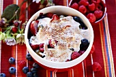 Berry gratin with almond sauce