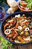 Paella with seafood and rabbit