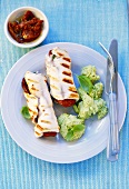 Grilled chicken roulades with tomato filling, basil puree