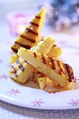 Grilled polenta slices with honey