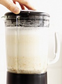 Almond milk with dates in liquidiser