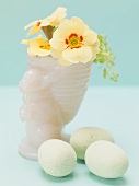 Primroses in Easter vase, eggs