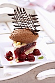 Piece of cherry cake with chocolate mousse